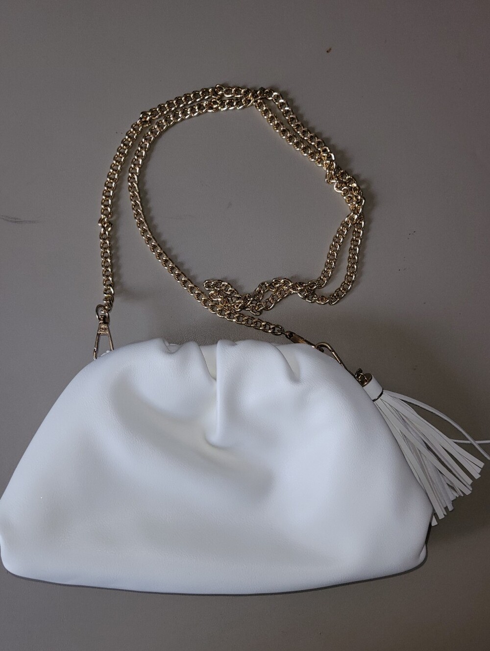 Understated Leather White Chain Strap Tassel Shoulder Bag and Dust Bag.